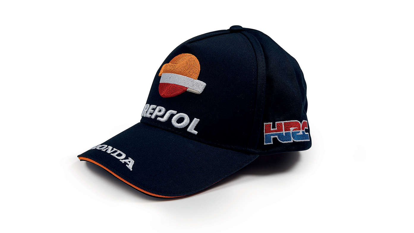 Boné azul com cores da equipa Honda MotoGP e logótipo da Repsol.