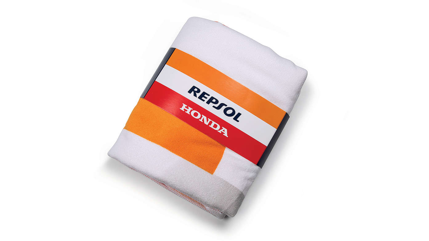 Toalha de praia da Honda Repsol com cores da Honda MotoGP e logótipo da Repsol.