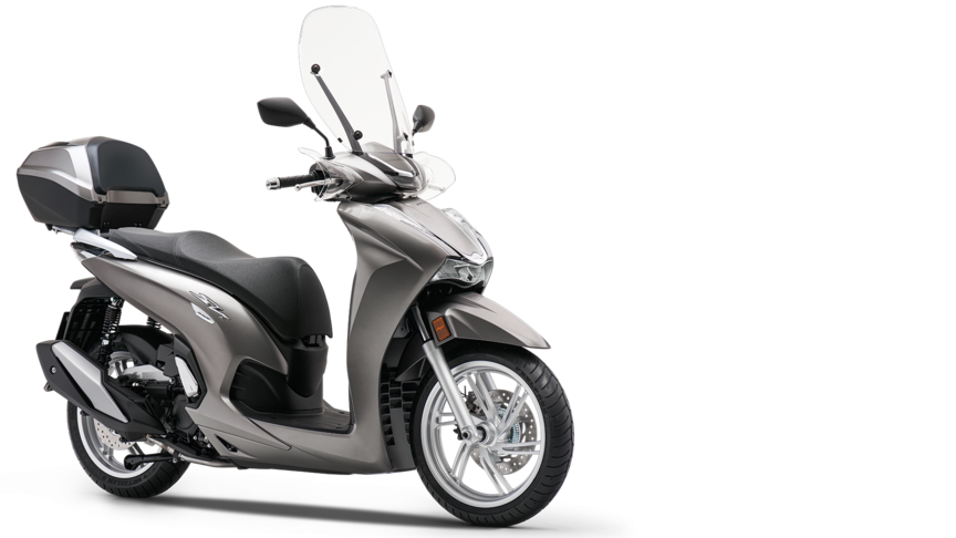 Vista dianteira a três quartos da Honda SH300i com mala traseira e para-brisas.